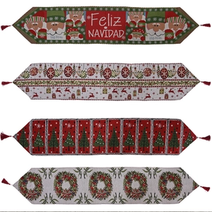 Set of four knitted Christmas table runners with tassels and holiday jacquard patterns