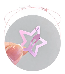 Close-up of pink star hair clip showing the durable metal snap closure mechanism