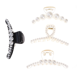 Set of four Korean-style faux pearl hair claws in black and transparent designs