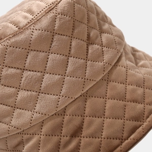 Quilted brown velvet bucket hat featuring a vintage plaid pattern for winter warmth