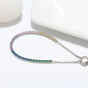 Detail of S925 sterling silver bracelet with colorful zircons and adjustable bolo clasp