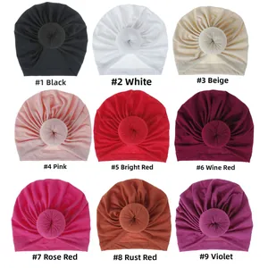 Selection of nine colorful donut-style turban headwraps for women and children
