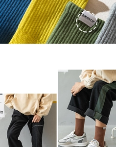 Detail of ribbed knit crew socks featuring Sunlight Up label and diverse retro colors
