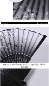 Detail of folding fan with white cherry blossoms and black butterflies on fine fabric