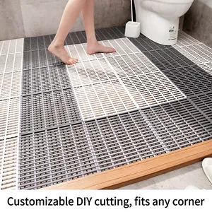 DIY interlocking non-slip bathroom mats in grey and white with striped drainage design