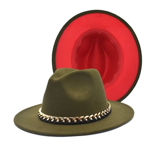 Detail of olive green fedora with metallic chain and contrasting bright red interior lining