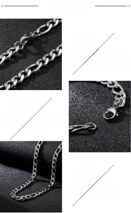 Detailed macro view of 316L stainless steel Figaro chain with secure lobster clasp closure