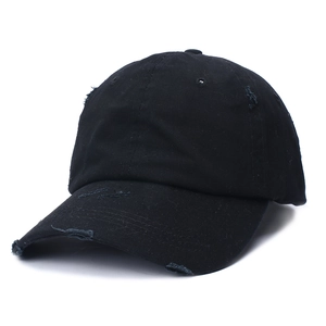Detail of black cotton ponytail baseball cap featuring distressed vintage ripped fabric texture