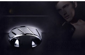 Detail of matte 316L stainless steel men's ring with black diagonal engraved lines