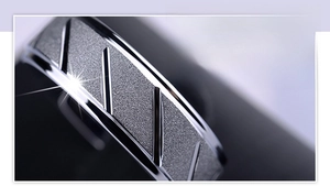 Macro detail of 316L stainless steel ring with frosted finish and polished grooves