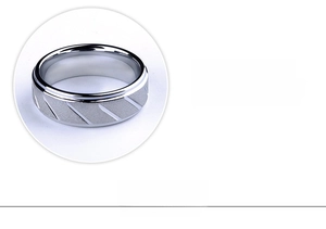 Close-up of matte silver ring with diagonal textures and ergonomic polished inner arc