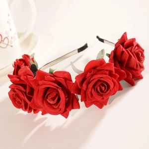 Detail of red rose headband featuring five realistic fabric flowers on a slim metal frame