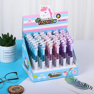 Detail of 36 unicorn LED pens in pink, purple and blue displayed with stationery decor