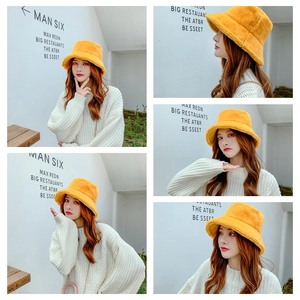 Detailed views of yellow faux fur bucket hat showing warm plush texture and fit
