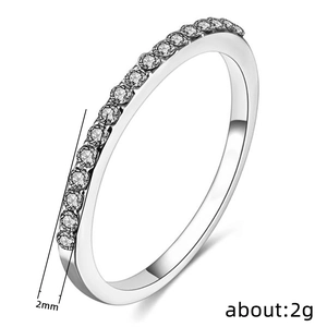 Minimalist 2mm silver-tone half eternity ring with micro-paved cubic zirconia