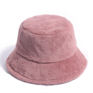 Close-up of pink faux fur bucket hat showing plush texture and warm winter material