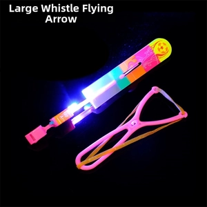 Detail of large whistling flying arrow toy with LED lights and pink slingshot launcher