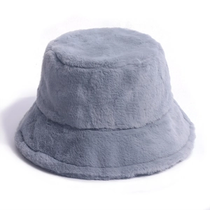 Close-up of the plush grey faux fur texture and soft fiber detail on the winter bucket hat