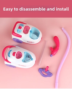 Close-up of kids vacuum cleaner toy parts with pink hose and purple nozzles