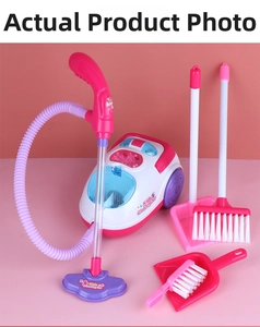 Detailed close-up of kids cleaning play set with toy vacuum, broom, and dustpan in pink