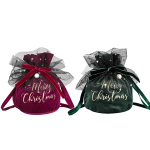 Velvet Christmas gift bags in red and green with lace bow and pearl pendant