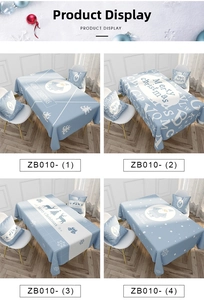 Detail view of light blue Christmas tablecloths featuring Santa and reindeer patterns