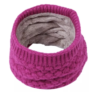 Detail of chunky rose red knit infinity scarf with thick grey fleece lining for winter