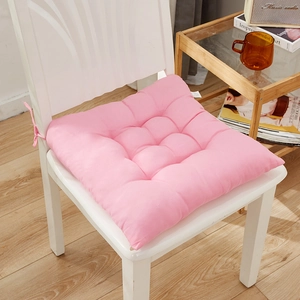 Pink square thickened chair cushion with quilted design and ties for secure seating