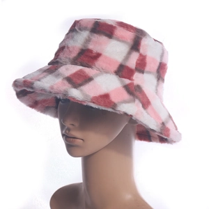 Close-up detail of a pink and white plaid fuzzy bucket hat made of plush material