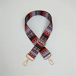 Detailed view of bohemian woven adjustable strap with golden lobster clasps and hardware