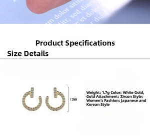 Detail showing 12mm minimalist U-shaped hoop earrings with white zircon in silver and gold