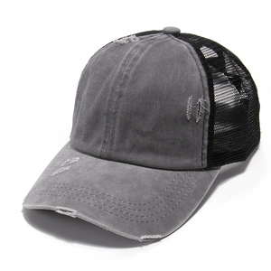 Detail of distressed grey washed canvas baseball cap with black mesh and ponytail opening