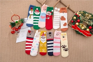 Detailed view of assorted Christmas coral fleece socks with festive snowman patterns