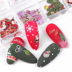 Christmas nail art wood pulp slices with Santa and reindeer motifs in a 12-grid storage box