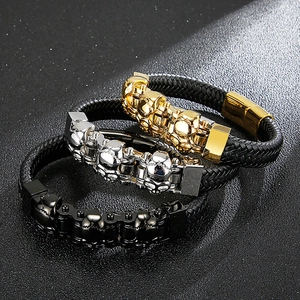 Men's punk braided leather bracelets with steel skulls in gold, silver, and black tones