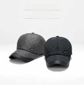 Close-up of quilted winter baseball caps with ear protection and sport label detail