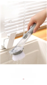 Detail of liquid soap kitchen brush with bamboo fiber bristles and shovel design
