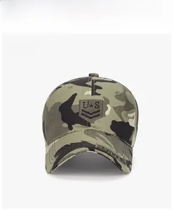 Front detail of camo baseball cap featuring U.S. star patch and Army brim embroidery
