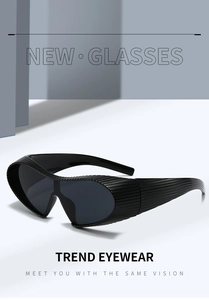 Detail of black steampunk sunglasses showing unique textured frame and futuristic lens design