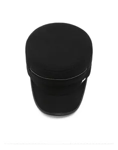 Top view of a thick black flat top military cap with a glossy decorative strap