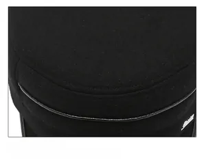 Detailed view of strict cap suture technique on a black winter flat top hat
