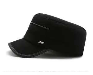 Detailed side view of black cadet cap with metal logo plate and faux leather brim piping