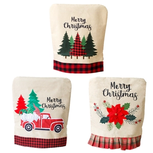 Three Christmas linen chair covers with festive prints and plaid trim on white background