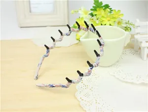 Detail of floral fabric non-slip headband with teeth on a rustic wooden background