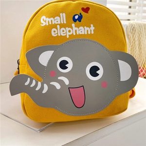 Close-up of yellow canvas backpack with a cute grey elephant patch and Small elephant text