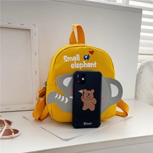 Detailed view of small yellow canvas backpack with elephant design and size comparison