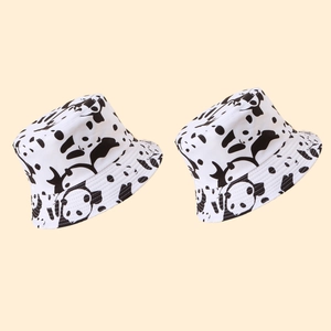Panda print bucket hats in black and white styles, stylish sun protection headwear