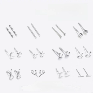 Macro display of 12 pairs minimalist 999 sterling silver ear sticks in various shapes