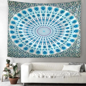 Detailed blue peacock mandala tapestry hanging as wall decor in a modern living room setup