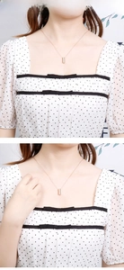 Minimalist cylindrical rose gold pendant necklace on a delicate chain for women